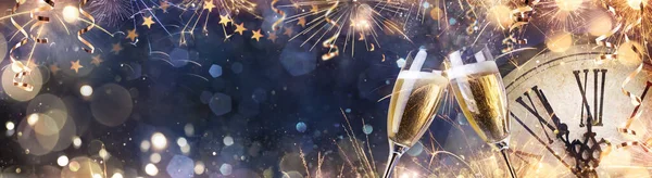 New Year Celebration In Eve Night - Toast With Champagne Clock Face And Fireworks - Party With With Abstract Defocused Lights