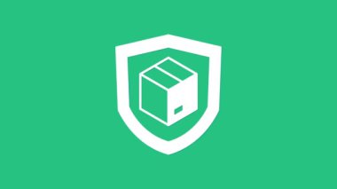 Yeşil arka planda kalkan simgesi olan beyaz teslimat güvenliği. Teslimat sigortası. Kalkanın ötesinde sigorta kutuları var. 4K Video hareketli grafik canlandırması.