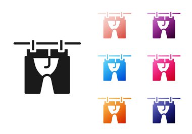 Siyah Kurutma ikonu beyaz arkaplanda izole edilmiş. Temiz gömlek. Çamaşırları çamaşır mandallarıyla iple yıka. Kıyafet bakımı ve düzenlilik. Simgeleri renklendirin. Vektör.