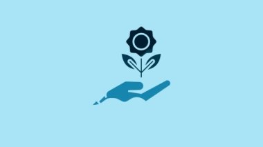 Blue Hand holding flower icon isolated on blue background. Seed and seedling. Planting sapling. Ecology concept. 4K Video motion graphic animation.