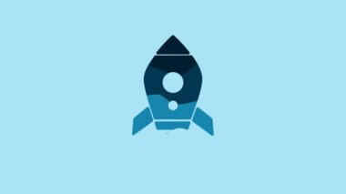Blue Rocket ship with fire icon isolated on blue background. Space travel. 4K Video motion graphic animation.