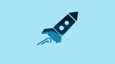 Blue Rocket ship with fire icon isolated on blue background. Space travel. 4K Video motion graphic animation.