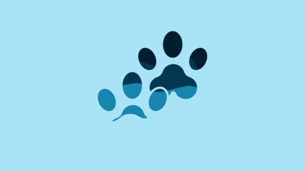青の背景に分離された青のプリントアイコン 犬や猫の足のプリント 動物の足跡だ 4Kビデオモーショングラフィックアニメーション — ストック動画