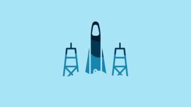 Blue Rocket launch from the spaceport icon isolated on blue background. Launch rocket in space. 4K Video motion graphic animation.