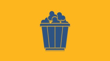 Blue Popcorn in cardboard box icon isolated on orange background. Popcorn bucket box. 4K Video motion graphic animation .