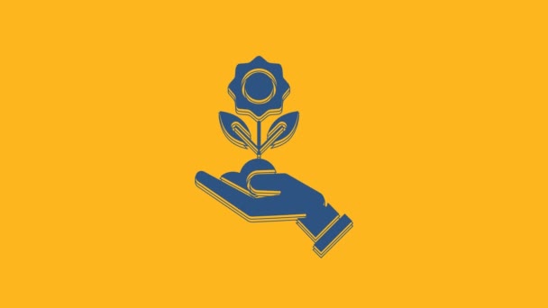 蓝色的手拿着花的图标孤立在橙色的背景上 种子和幼苗 种植树苗 生态概念 4K视频运动图形动画 — 图库视频影像