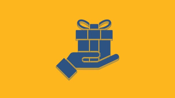 Blue Gift Box Handen Ikon Isolerad Orange Bakgrund God Jul — Stockvideo