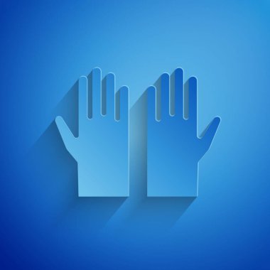 Kağıt kesiği tıp eldiveni ikonu mavi arka planda izole edilmiş. Koruyucu lastik eldivenler. Kağıt sanatı tarzı. Vektör.