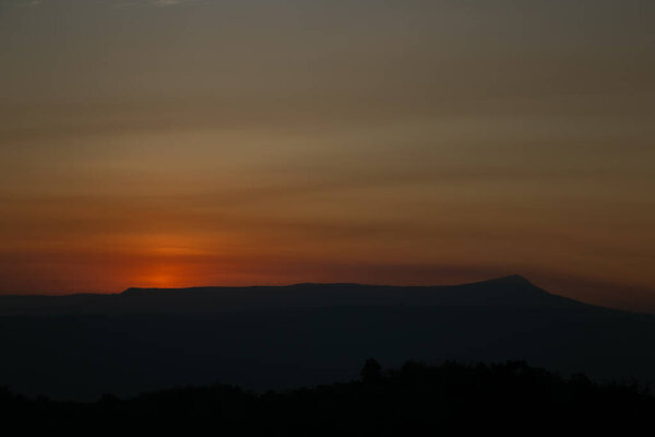 The morning of sunshine behind the Khao Yai national park mountain  in the  winter of Thailand. Asia sunrise view