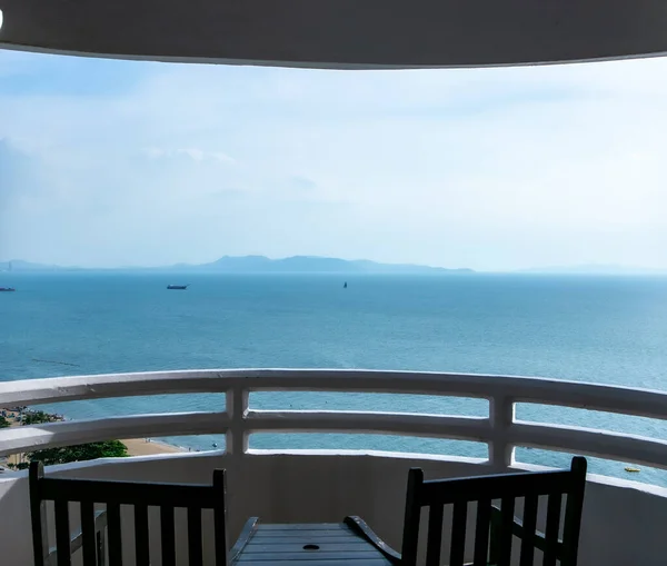 stock image The white terrace of the luxury room of hotels with a sea view in the Pattaya of Thailand. Sea view room and high-take view. The sea in Pattaya