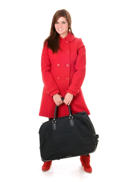 Atraktivní Žena Červeném Kabátě Taškou Nebo Kufrem Bílém Pozadí — Stock fotografie