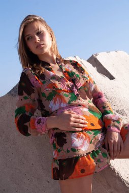 Attractive young woman in a coastal environment near the sea