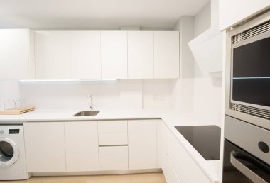 modern kitchen perfectly equipped with its appliances in a house