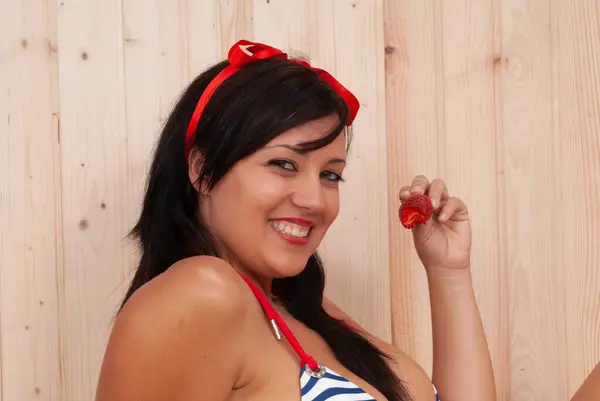 Beautiful Young Woman Curves Wearing Red Bikini Eating Strawberry Стокове Фото