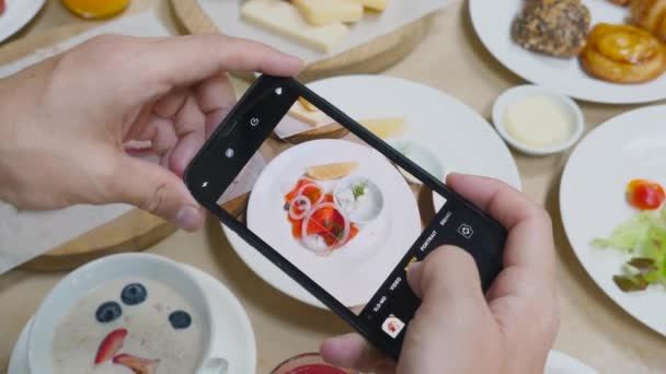 Man Taking Photo Delicious Smoked Salmon Food Mobile Phone Restaurant — Stockvideo