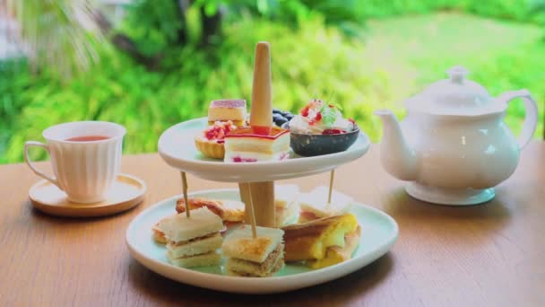 Elegance Tea Ceremony Shelf Filled Fresh Pastries Cakes Sandwiches Afternoon — Vídeos de Stock