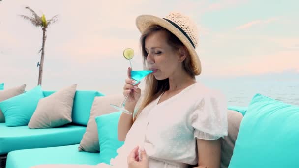 Young Woman Straw Hat Drink Blue Cocktail While Lounging Beach — Αρχείο Βίντεο