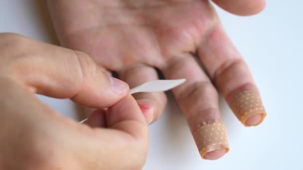 Man Applying Band Aid Patch Cuts Wound Fingers Male Putting — Stockvideo