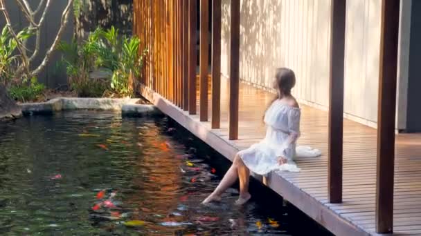 Woman Relaxing Luxury Spa Barefoot Wooden Bridge Fish Pond Enjoying — Video Stock