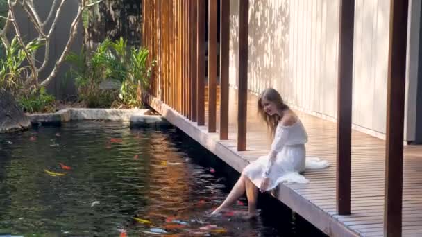 Woman Relax Luxury Spa Fish Pond Enjoy Bright Morning Nature — Stock Video