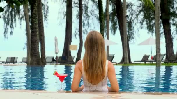 Back View Woman Model Lounging Blue Swimming Pool White Bikini — Stock Video