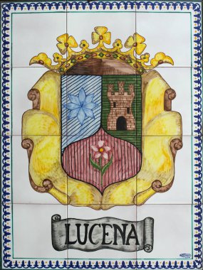 Lucena, Spain - Jun 1st, 2019: Lucena coat of arms on glazed tile panel. Village is located in the south east of the province, near the Sierras Subbeticas, Cordoba, Spain