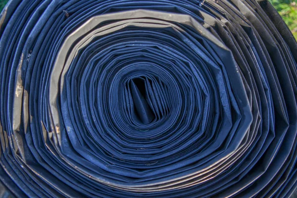 Rolled tape of flexible irrigation tubing system. Overhead view