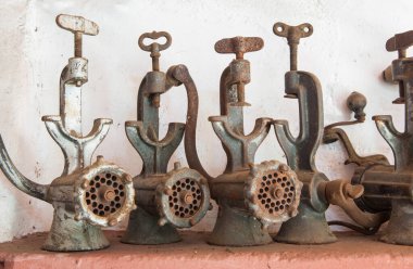 Old manual mincers  used during traditional home slaughtering. Country style background