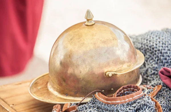 Roman Montefortino helmet over lorica hamata or chain mail armour. Roman military personal equipment replica