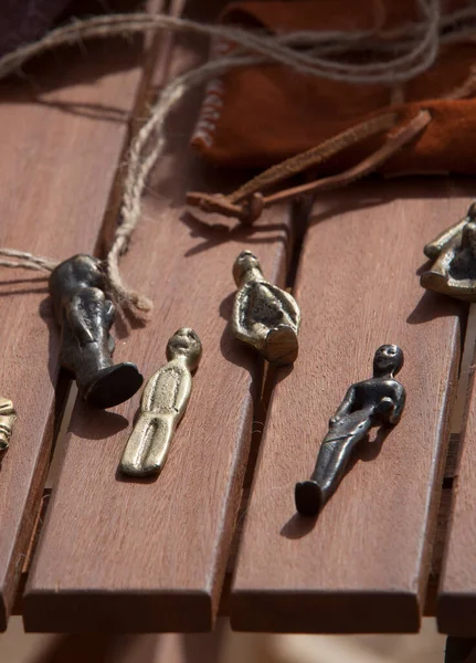 stock image Celtiberian ex-voto figurine replicas over wooden table. Celtiberian people beliefs