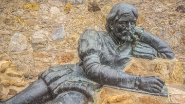 Llerena, Spain - Jun 26th, 2021: Pedro Cieza de Leon sculpture. Spanish conquistador and chronicler. Unknown artist, 2018 clipart