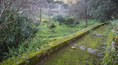 P. de Acim, Spain - Jan 21st, 2024: Exterior gardens of El Palancar Convent, Pedroso de Acim, Caceres, Spain clipart