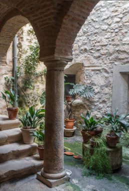 P. de Acim, Spain - Jan 21st, 2024: Old cloister of El Palancar Convent, Pedroso de Acim, Caceres, Spain clipart