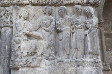 Church of San Miguel portal. Estella-Lizarra town, Navarre, Northern Spain. Three Marys before Christs tomb clipart