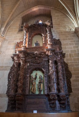 Estella, Spain - March 30, 2024: Side altarpiece of  Church of San Miguel. Estella, Navarre, Spain clipart