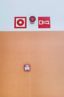 Alarm buttons and sound signaling installed over corridor wall. Fire alarm system concept clipart