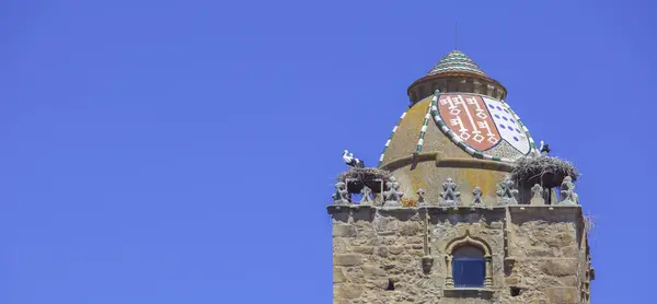 stock image Alfiler tower, 14th Century Gothic belfry adorned with glazed roof tiles. Trujillo, Caceres, Spain