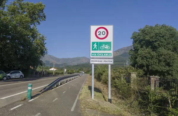 stock image Hervas, Spain - 24th, Jul, 2024: Segregated cycle lane running parallel to a local road. Traffic sign limiting traffic to cyclists and pedestrians