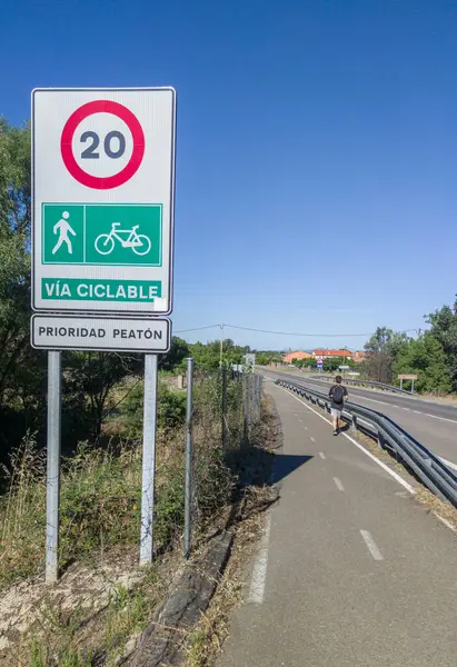 stock image Hervas, Spain - 24th, Jul, 2024: Segregated cycle lane running parallel to a local road. Traffic sign limiting traffic to cyclists and pedestrians