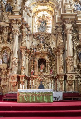 Coria, Spain - August 31th, 2023: Coria Cathedral of Our Lady of Assumption, Caceres, Spain. Main altarpiece clipart