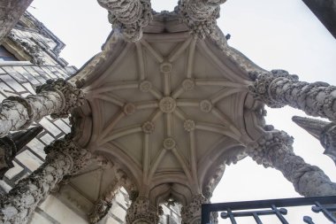 Sintra, Portugal, Aug 8th, 2024: Quinta da Regaleira, one of the principal tourist attractions of Sintra. Octagonal carved cover clipart