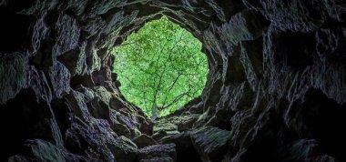 Sintra, Portugal, Aug 8th, 2024: Quinta da Regaleira, one of the principal tourist attractions of Sintra. Unfinished Well clipart