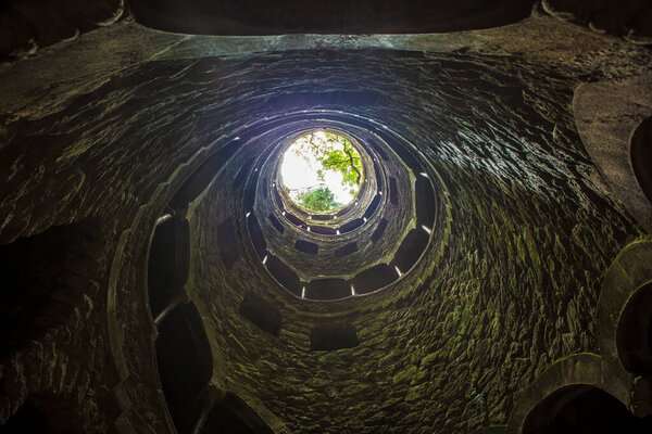 Sintra, Portugal, Aug 8th, 2024: Quinta da Regaleira, one of the principal tourist attractions of Sintra. Initiation Well