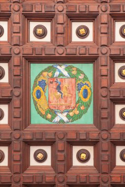 Plaza de Espana wooden coffered ceiling painted with the coat of arms province, Seville, Spain clipart