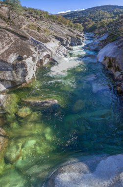 Los Pilones area, huge granite roundshaoed forms, carved out by river erosion. Garganta de los Infiernos Reserve. Extremadura, Spain clipart