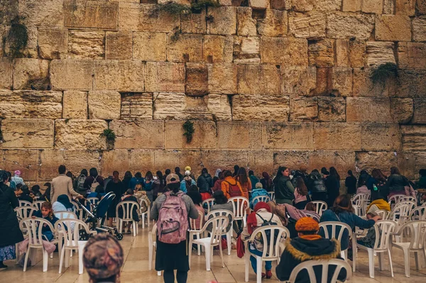 stock image November 27, 2022 - Jerusalem, Israel. Tourist crowd and Jewish gather for Shacharit sunrise prayer at Old City Western Wailing Wall, holy place in Judaism. Temple Mount and Mount of Olives. 