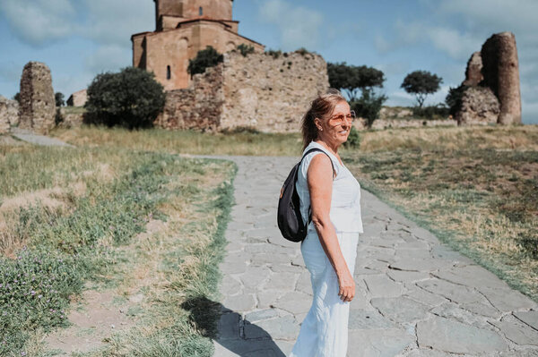 Happy Senior Traveling Mature Woman Backpacker Tourist Outdoors Ancient Europe Stock Image