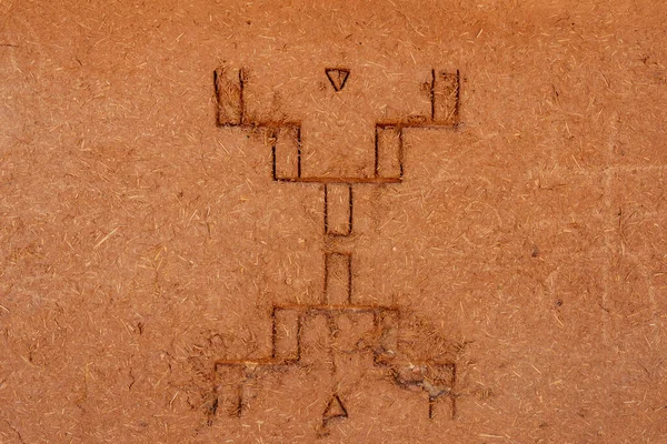 North Africa. Morocco. Ksar Ait Benhaddou in the Atlas Mountains of Morocco. UNESCO World Heritage Site since 1987. A sign representing the free man engraved on a wall