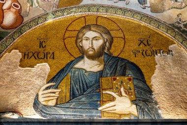 Turkiye. Istanbul. A partially restored ancient Art Byzantine mosaic depicting Jesus Pantokrator adorns the walls of Saint-Sauveur-in-Chora (Kariye Museum) clipart