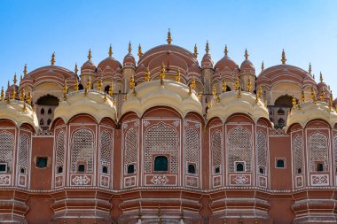 India. Rajasthan. Jaipur (The pink city). Hawa Mahal. (Palace of the Winds). Architecture detail of the facade clipart